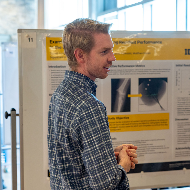 male at the educational innovation poster session