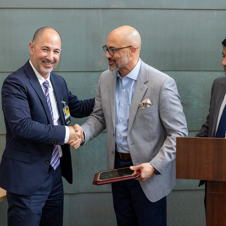 An award is presented at Med Ed Day 2026.