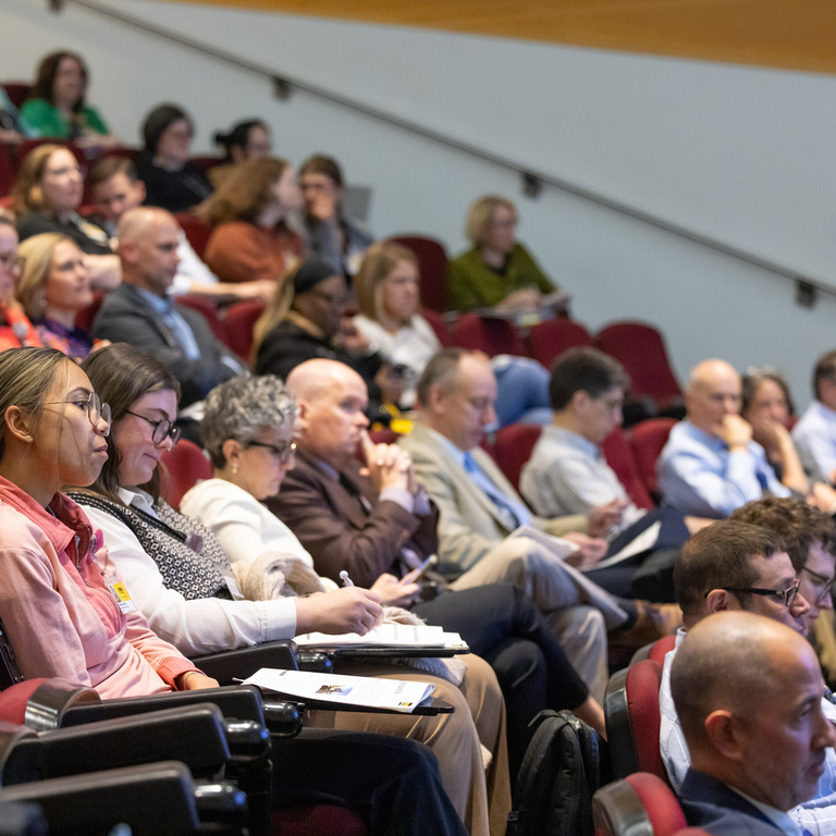 The audience is seated theater style at Med Ed Day 2026.