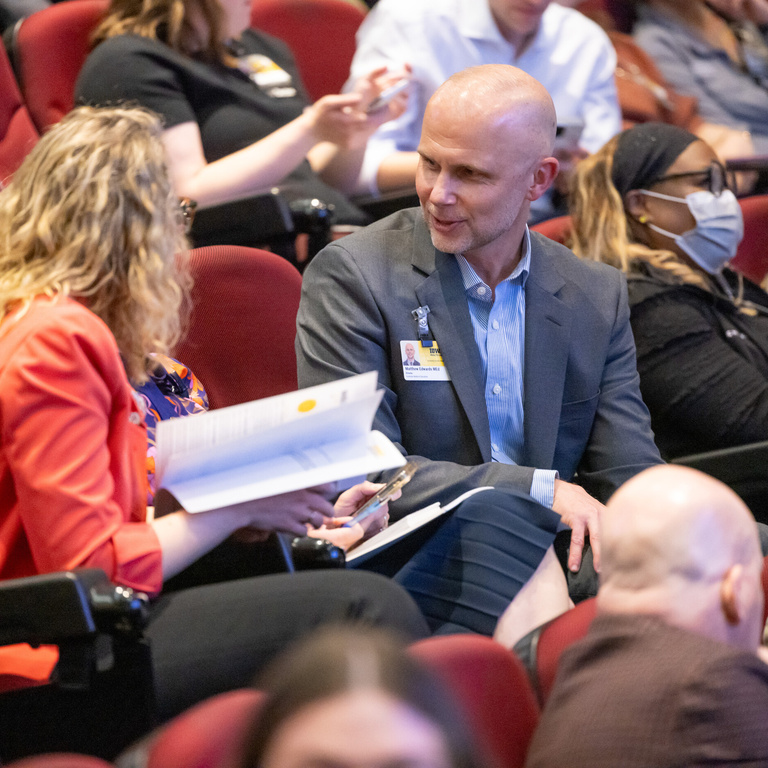 A conversation between colleagues at Med Ed Day 2026.