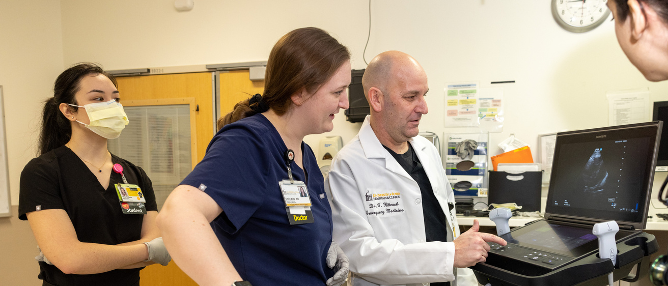 Emergency Medicine resident with doctor and student trainee