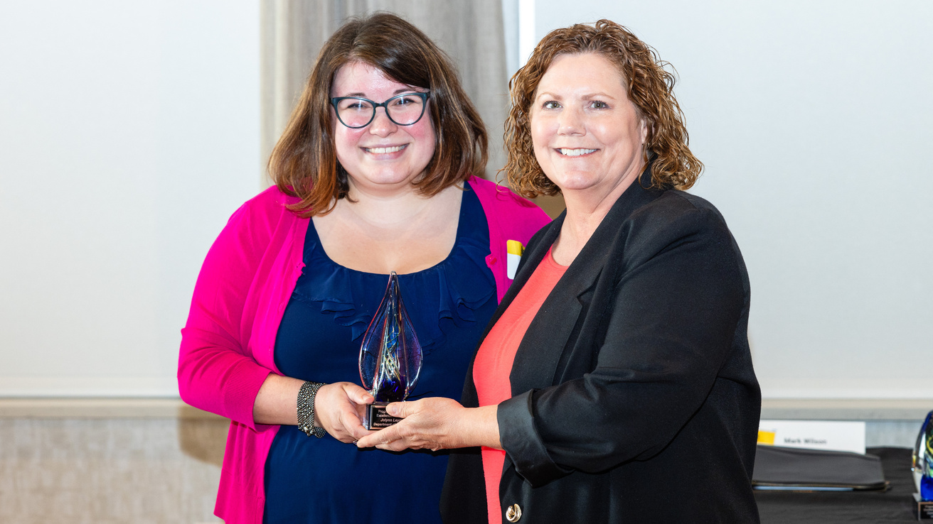 Briana Horwath presents Jolynn Leyden (Pediatrics) with her 2025 Program Coordinator Award.